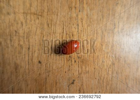 Lutein Capsule On Wooden Table From Above