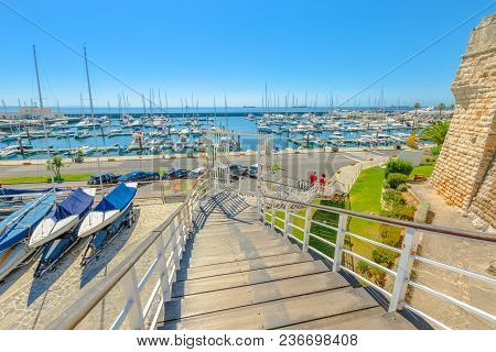 Cascais, Portugal - August 6, 2017: Boats Anchored At Marina De Cascais Alongside Fortress Of Our La