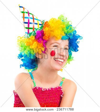 Funny little girl in clown wig with red spots on her cheeks isolated on white background