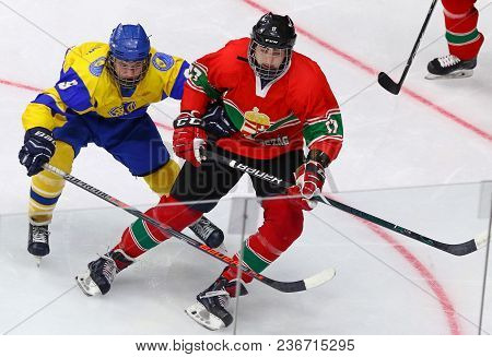 Kyiv, Ukraine - April 17, 2018: Bohdan Serednitskyy Of Ukraine (l) Fights For A Puck With Marcell Re