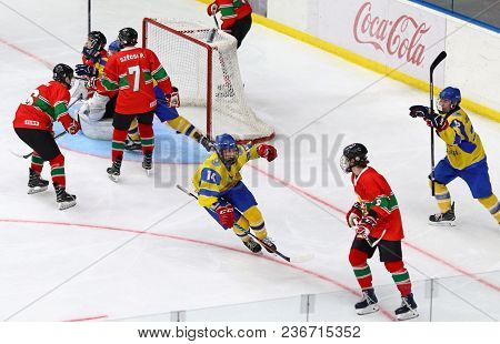 Kyiv, Ukraine - April 17, 2018: Ukrainian Players (in Yellow) Score A Goal During The Iihf 2018 Ice 