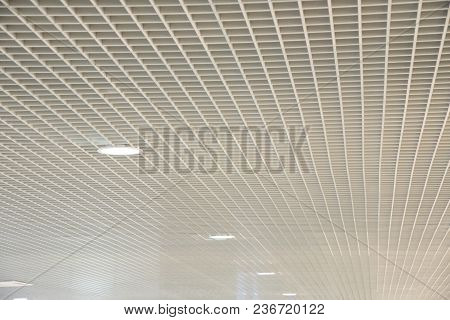 Smooth Beautiful White Trellised Ceiling With Indoor Lighting As A Background