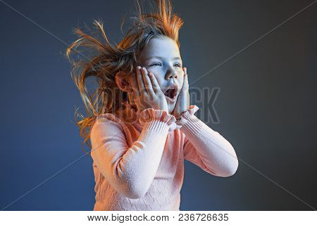 The Anger And Surprised Teen Girl. Hate, Rage. Crying Emotional Angry Teenager In Colorful Bright Li