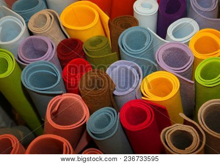 Many Colored Rolls Of Fabric In The Store
