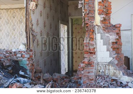 View Of A Dilapidated House. The Destroyed Walls In The Process Of Demolishing The Dilapidated House