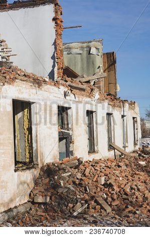 View Of A Dilapidated House. The Destroyed Walls In The Process Of Demolishing The Dilapidated House
