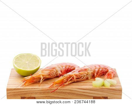 Argentine Red Shrimp On A Wooden Bred. Shrimp And Lemon Flatlay