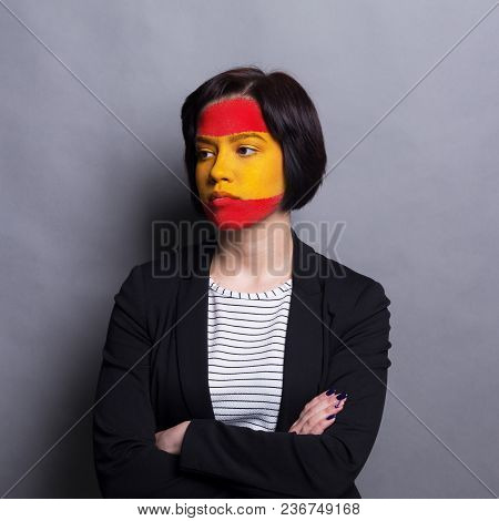 Face Of Young Desparate Woman Painted With Flag Of Spain. Football Or Soccer Team Fan, Sport Event, 