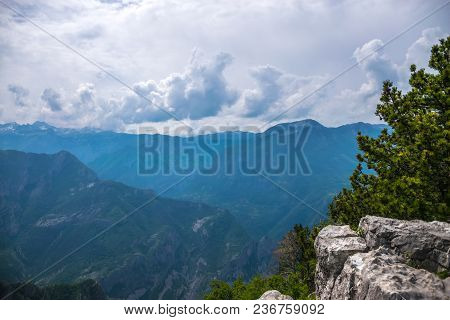The Tops Of The Picturesque Mountains Are Covered With White Snow.