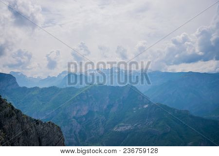 The Tops Of The Picturesque Mountains Are Covered With White Snow.