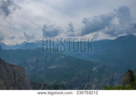 The Tops Of The Picturesque Mountains Are Covered With White Snow.