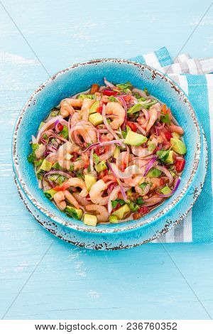 Mexican Food. Mexican Shrimps Ceviche Sebiche With Tomatoes And Avocado In Blue Bowl, Wooden Blue Ba