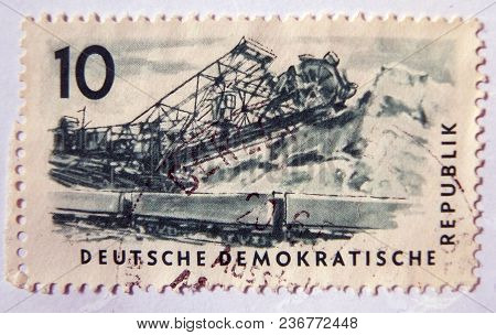 Leeds, England - April 18 2018: An Old Blue East German Postage Stamp With Image Of Railway Wagons A