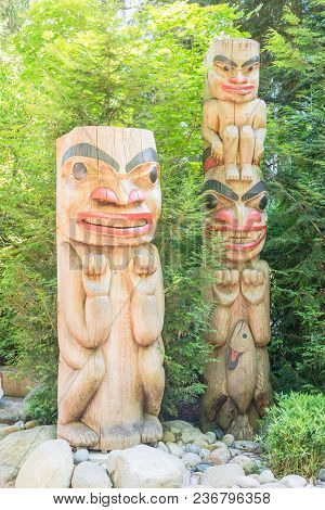Indian Totem Poles In Capilano Suspension Bridge In Vancouver, Canada