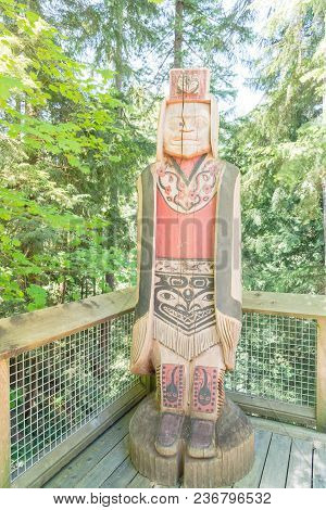 Indian Totem Poles In Capilano Suspension Bridge In Vancouver, Canada