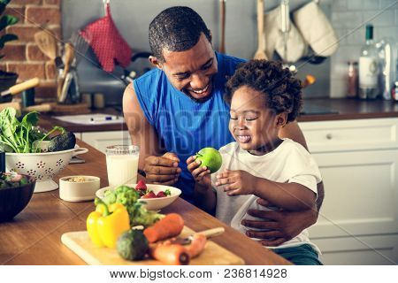 Dad and son cooking together