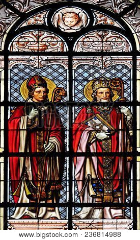 PARIS, FRANCE - JANUARY 10: Saint Hilarius and Saint Augustine, stained glass window in the Saint Augustine church in Paris, France on January 10, 2018.