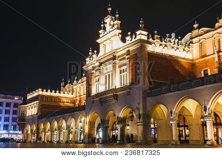 Krakow, Poland, December 15, 2017: Night View Of Main Market Square And Sukiennice In Krakow. Krakow