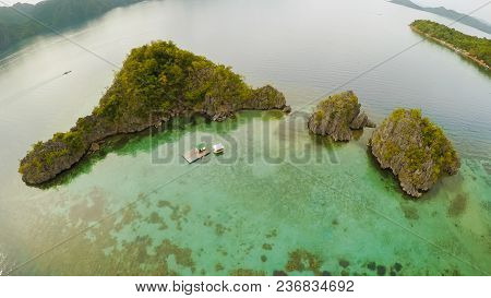 Aerial View Of Small Islands Siete Pecados With Boats In Coron Bay. Palawan