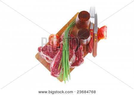 ready to cook: raw beef fillet mignon on cutting board prepared for roasting