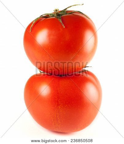 Two Red Juicy Tomato Isolated On White Background. Tomatoes On A White Background