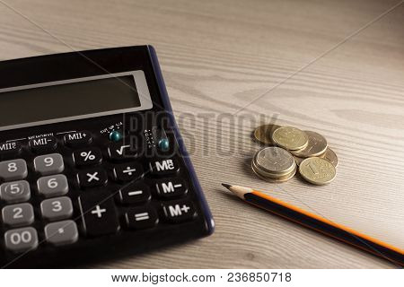 Calculator, Stamp, Stapler And Pencil On Wood Background