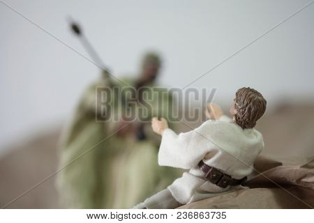 APR 17 2018: Recreation of a scene from Star Wars A New Hope; Luke Skywalker is attacked by a Tusken Raider on the desert planet of Tattooine - Hasbro Black Series 6 inch action figures