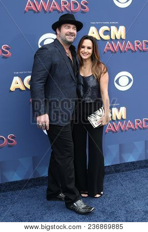 LAS VEGAS-APR 15: Singer Lee Brice (L) and wife Sara attend the 53rd Annual Academy of Country Music Awards on April 15, 2018 at the MGM Grand Arena in Las Vegas, Nevada.