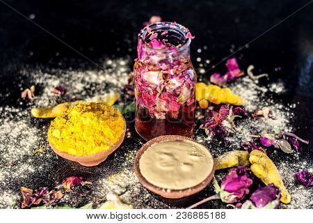 Ayurvedic Ubtan Of Haldi With Holy Rose Water And Fuller’s Earth On Wooden Surface For Good, Brighte