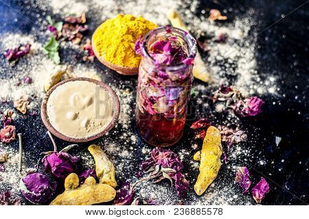 Ayurvedic Ubtan Of Haldi With Holy Rose Water And Fuller’s Earth On Wooden Surface For Good, Brighte