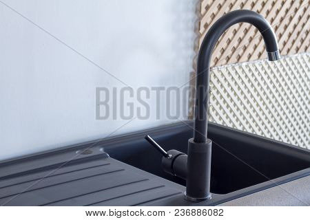 Modern Kitchen And Bathroom Water Faucets In The Store. Selective Focus. There Is Free Space For Tex