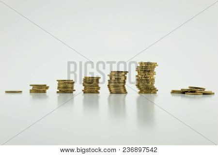 Stack Of Gold Coins, Six Rows Isolated On White Background With Clipping Path. Growing And Saving Mo