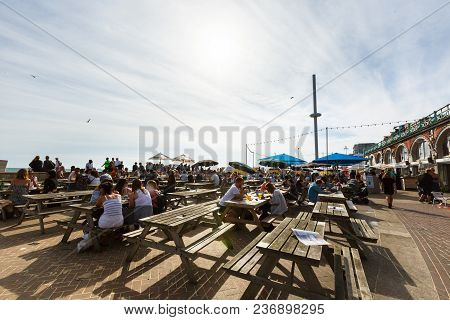 Brighton, United Kingdom - August 1, 2017: Tourists Admire The Amazing View Of English Channel And T