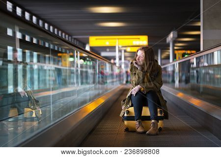 The Girl Is Riding On The Travolator