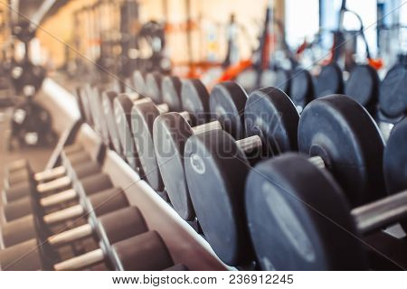 Rows Of Dumbbells In The Gym With Hign Contrast And Monochrome Color Tone