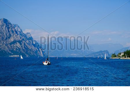 Whaite Yacht On A Mouuntain Lake Lago Di Garda
