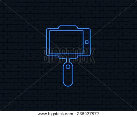 Neon Light. Monopod Selfie Stick Icon. Self Portrait Tool. Glowing Graphic Design. Brick Wall. Vecto