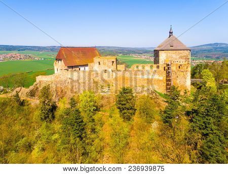 Aerial view of Tocnik Castle. A royal chateau of Wenceslas IV from the 14th century, adjusted in the Renaissance and the Baroque styles.