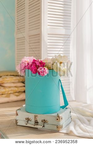 Composition Of Flowers In A White Hatbox.