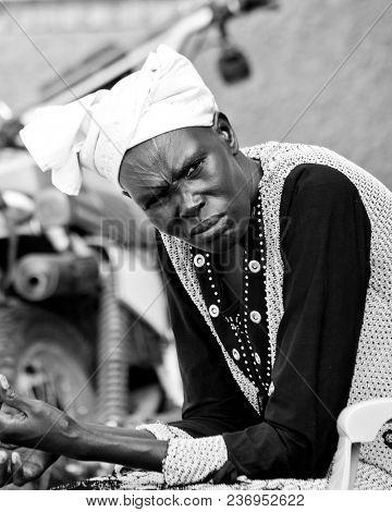 BOR, SOUTH SUDAN-JUNE 23, 2012: Portrait of a Dinka woman with tribal scarification taken in the town of Bor, South Sudan.