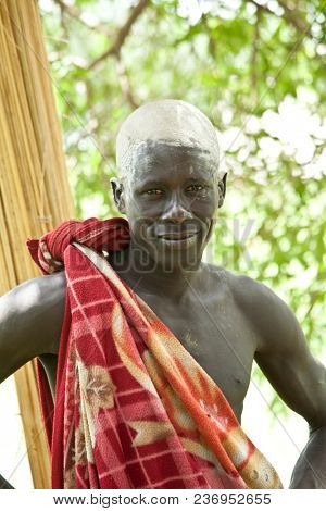 LILIIR, SOUTH SUDAN-JUNE 25, 2012: Illustrative editorial portrait of a Dinka cattle herder in the village of Liliir, South Sudan.