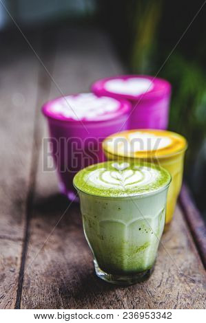 Beetroot, Matcha, Turmeric Lattes Are On The Marble Table With Art Floor On The Background, Trendy H