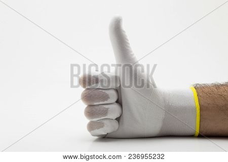 Hand Thumb Up Of A Man In A Glove On White Background Isolation