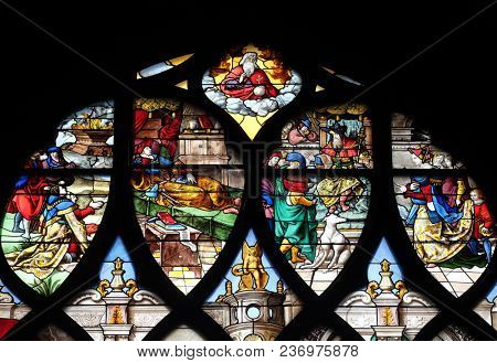 PARIS, FRANCE - JANUARY 11, 2018: Sacrifice and Solomon's Dream in Gabaon, and right, the Visit of the Queen of Sheba, stained glass windows in the Saint Gervais and Saint Protais Church, Paris.
