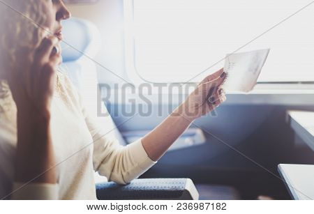 Enjoying Business Travel Concept. Young Beautiful Brunette Tourist Girl Travelling On The Train Sitt