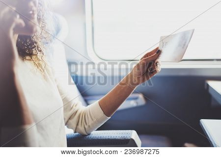 Enjoying Business Travel Concept. Young Beautiful Brunette Tourist Girl Travelling On The Train Sitt