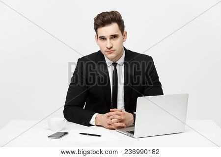 Portrait Of Confident Manager Sitting At Desk And Looking At Camera. Portrait Of Business Man Workin