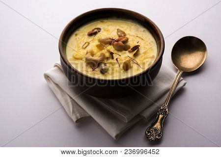 Kheer Or Rice Pudding Is An Indian Dessert In A Brown Terracotta Bowl With Dry Fruits Toppings