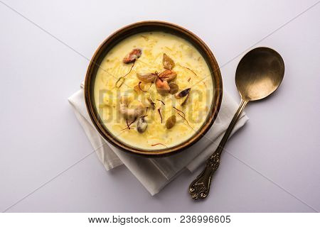 Kheer Or Rice Pudding Is An Indian Dessert In A Brown Terracotta Bowl With Dry Fruits Toppings