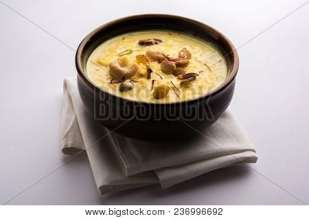 Kheer Or Rice Pudding Is An Indian Dessert In A Brown Terracotta Bowl With Dry Fruits Toppings